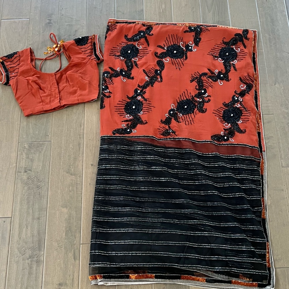 Gorgeous saree with bead work. Never worn.